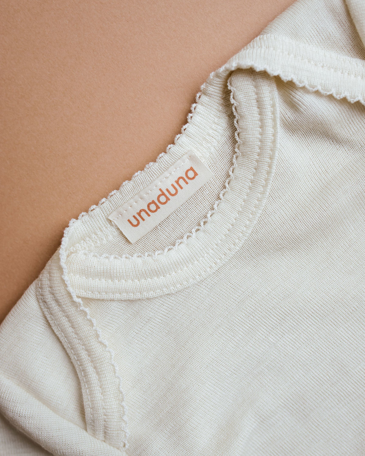 unaduna-body-crochet-edge-longsleeves-natural-baby