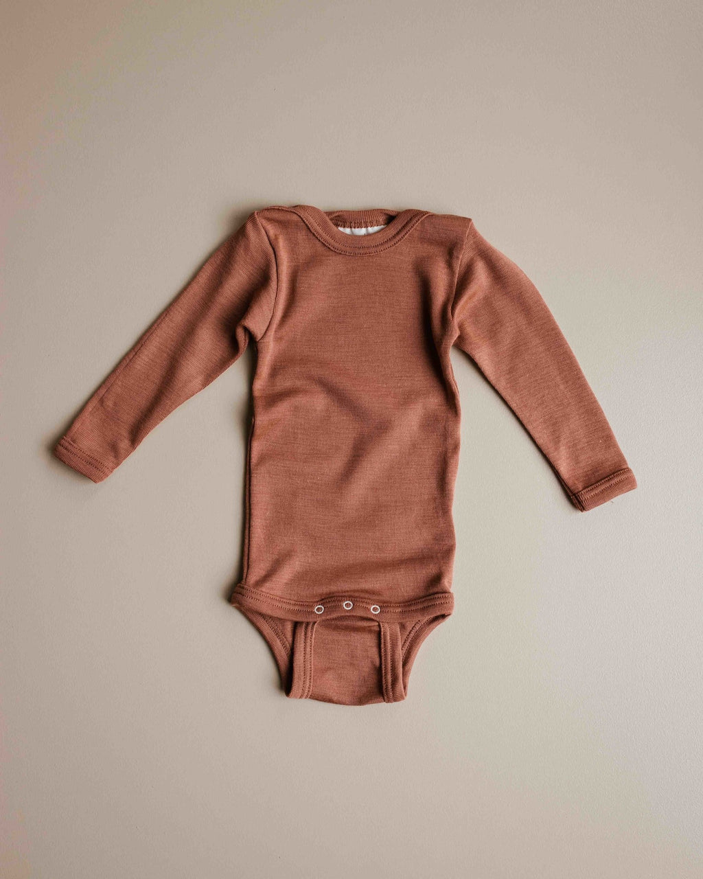 unaduna-sienna-clay-baby-rompertje-lange-mouw-wol